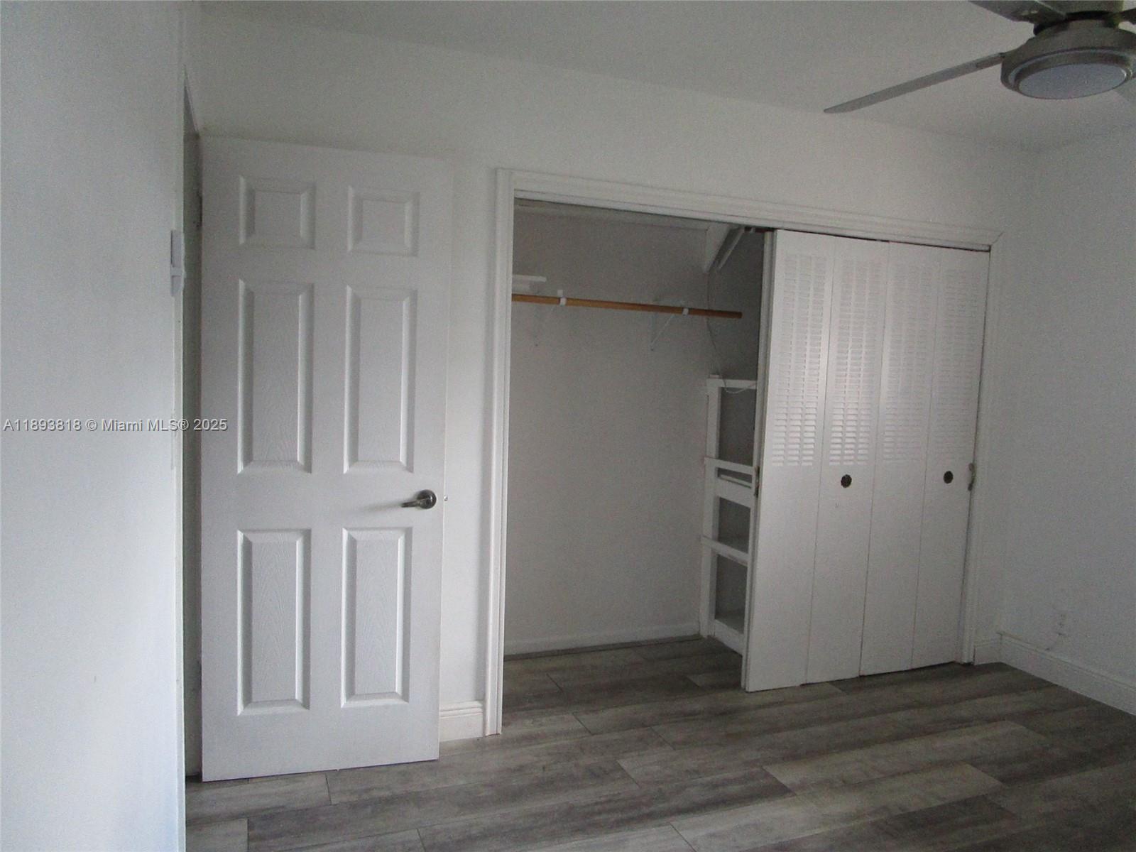 8101 Southwest 24th Court, Unit 206 Davie, FL 33324 - Photo 22 of 41 an empty room with wooden floor and closet area