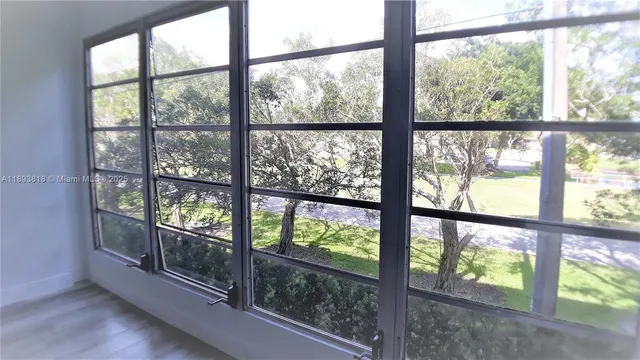 an empty room with wooden floor