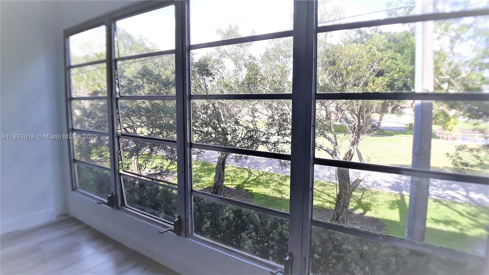 8101 Southwest 24th Court, Unit 206 Davie, FL 33324 - Photo 24 of 41 an empty room with wooden floor