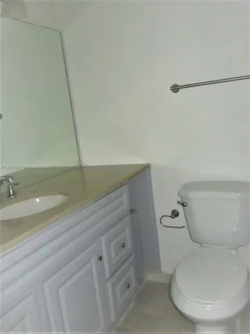 a bathroom with a toilet and a sink