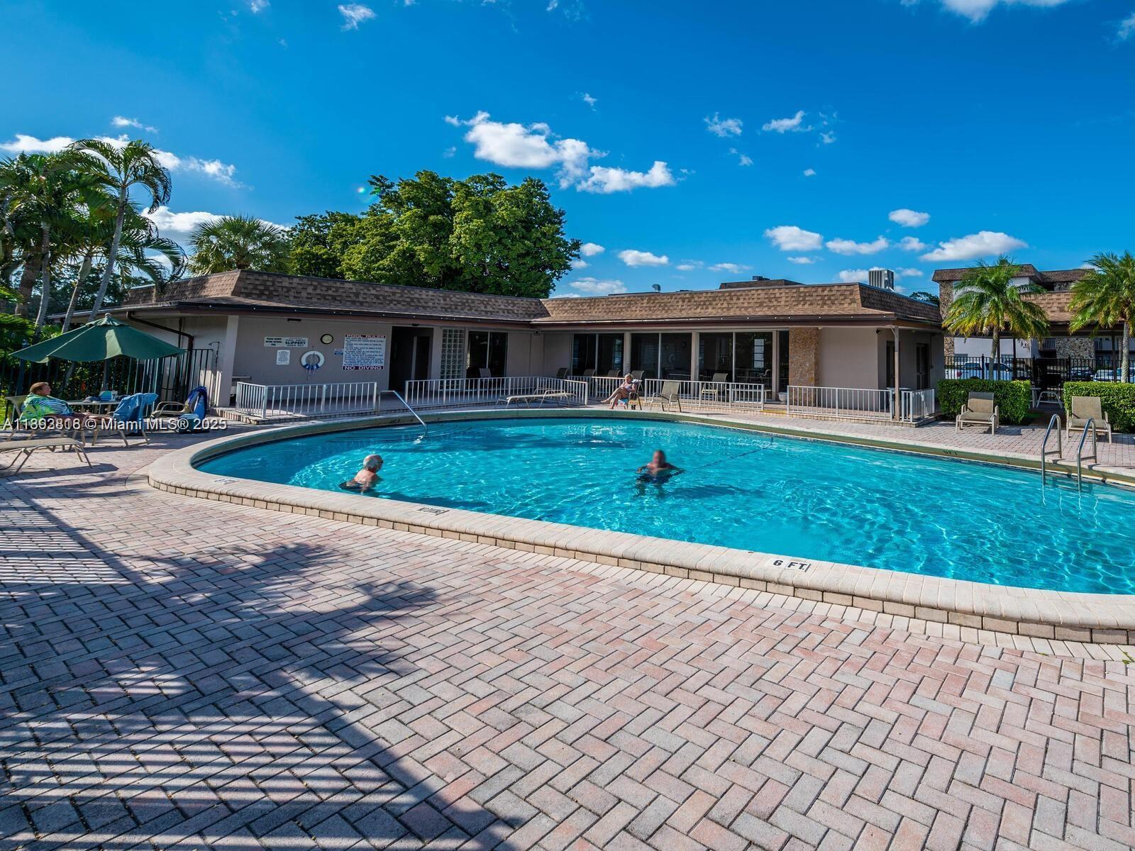 8101 Southwest 24th Court, Unit 206 Davie, FL 33324 - Photo 36 of 41 a front view of a house with a yard