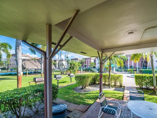 a view of yard with an outdoor seating