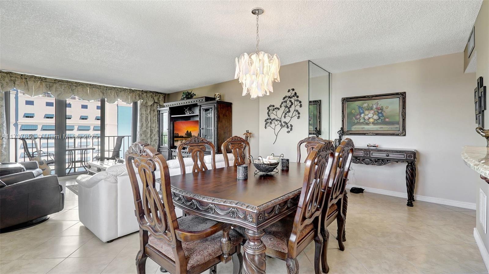 322 Buchanan Street, Unit 907 Hollywood, FL 33019 - Photo 18 of 45 a view of a dining room with furniture window and outside view