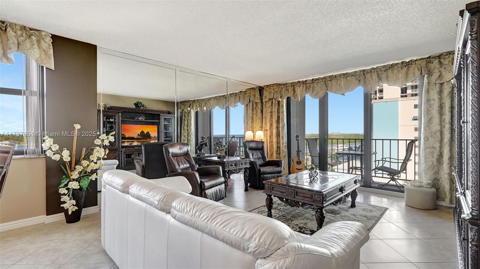 322 Buchanan Street, Unit 907 Hollywood, FL 33019 - Photo 19 of 45 a living room with furniture and a large window
