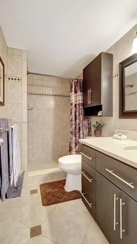 a view of a bathroom with a glass shower door
