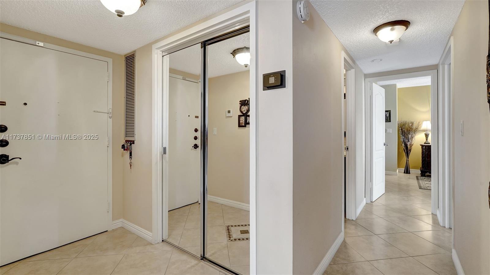 322 Buchanan Street, Unit 907 Hollywood, FL 33019 - Photo 25 of 45 a view of a bathroom with a glass shower door
