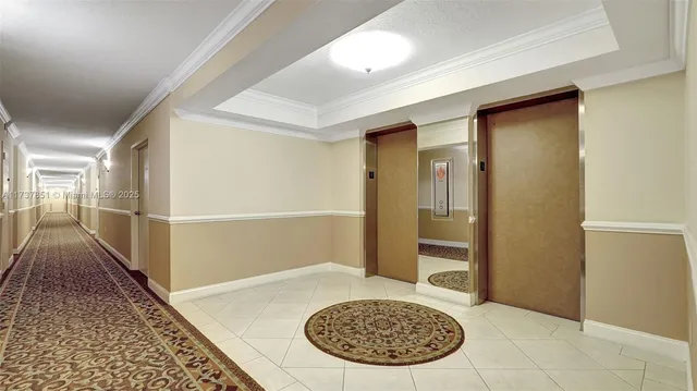a living room with couches and kitchen view with wooden floor