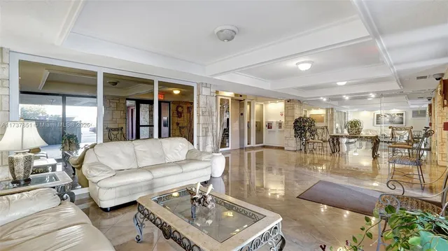 a view of a house with a small yard and deck