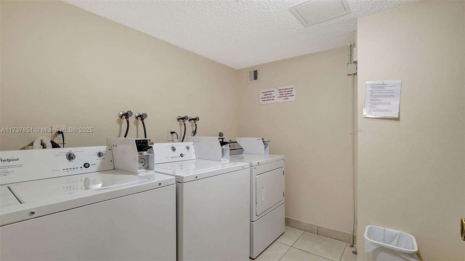 322 Buchanan Street, Unit 907 Hollywood, FL 33019 - Photo 35 of 45 a utility room with dryer and washer