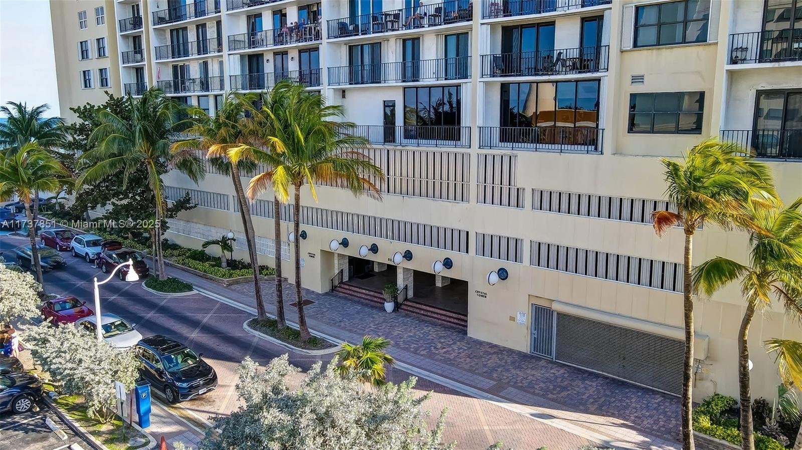 322 Buchanan Street, Unit 907 Hollywood, FL 33019 - Photo 37 of 45 a view of a house with a small yard and deck