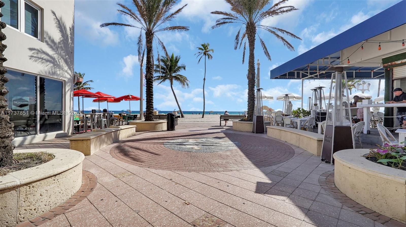 322 Buchanan Street, Unit 907 Hollywood, FL 33019 - Photo 38 of 45 a view of a swimming pool with a patio
