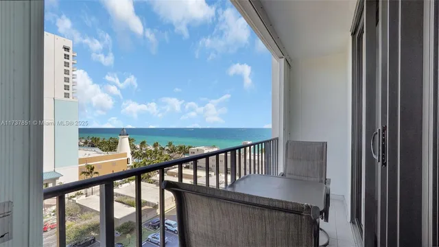 a kitchen with stainless steel appliances granite countertop a sink a stove and a microwave