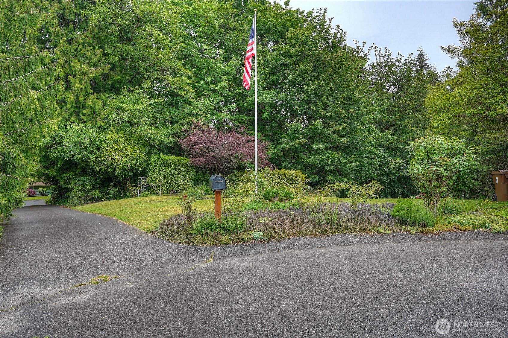 0 Agnes Road Northeast Tacoma, WA 98422 - Photo 9 of 21 a flag is sitting in the middle of a yard