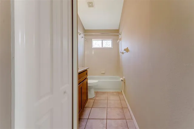 a bathroom with a sink a toilet and a shower
