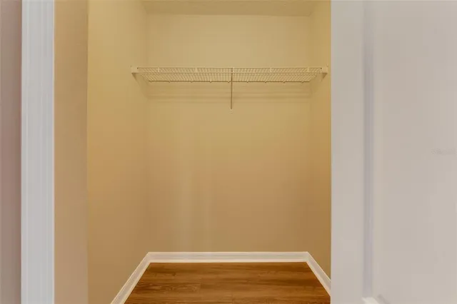 a bathroom with a double vanity sink mirror and shower