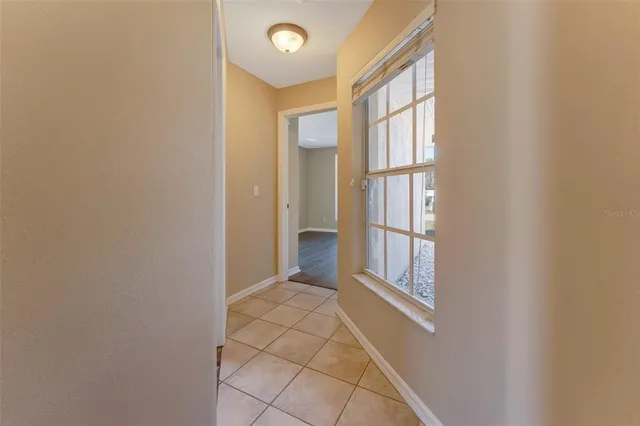 a view of an empty room with windows