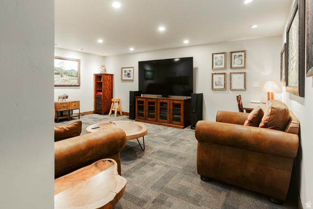 1667 West Tollgate Cyn Road Coalville, UT 84017 - Photo 45 of 61 Recessed lighting illuminates this versatile room, featuring light gray walls, dark wood-finish trim, and geometric pattern carpet