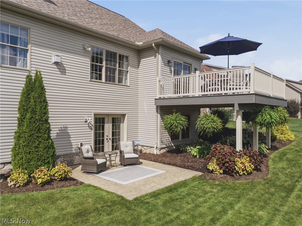 3955 Spring Brook Way Wooster, OH 44691 - Photo 44 of 50 Expansive outdoor deck with white railing, overlooking a patio