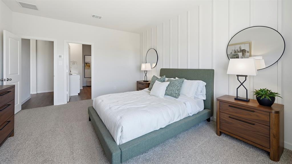 1957 Freeman Street Tyler, TX 75704 - Photo 15 of 25 Bedroom featuring a decorative vertical panel accent wall
