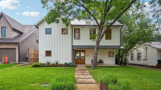 front view of a house with a yard