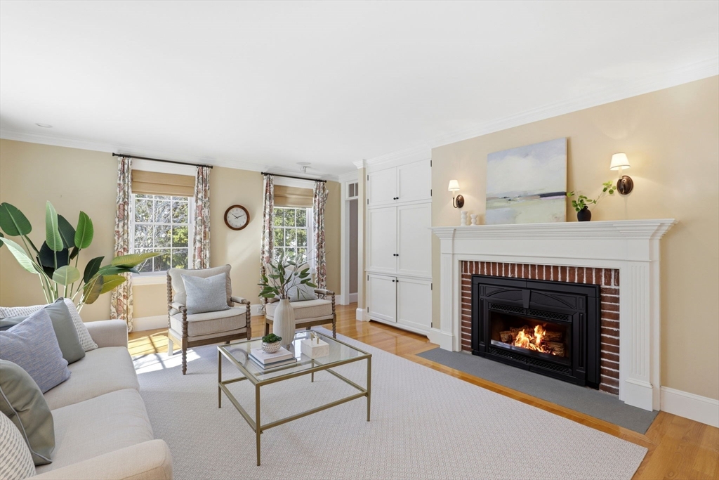 138 Judge Cushing Road Scituate, MA 02066 - Photo 11 of 40 a living room with furniture and a fireplace