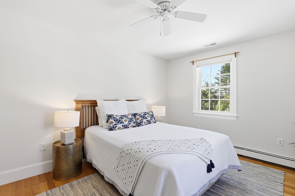 138 Judge Cushing Road Scituate, MA 02066 - Photo 20 of 40 a large bed sitting in a bedroom next to a window