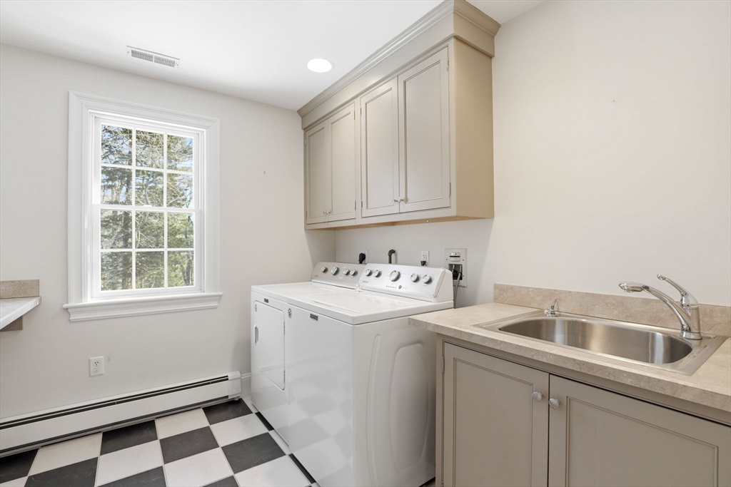 138 Judge Cushing Road Scituate, MA 02066 - Photo 21 of 40 a utility room with dryer and washer