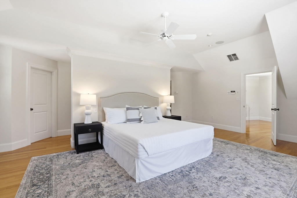 138 Judge Cushing Road Scituate, MA 02066 - Photo 24 of 40 a bedroom with a bed and wooden floor