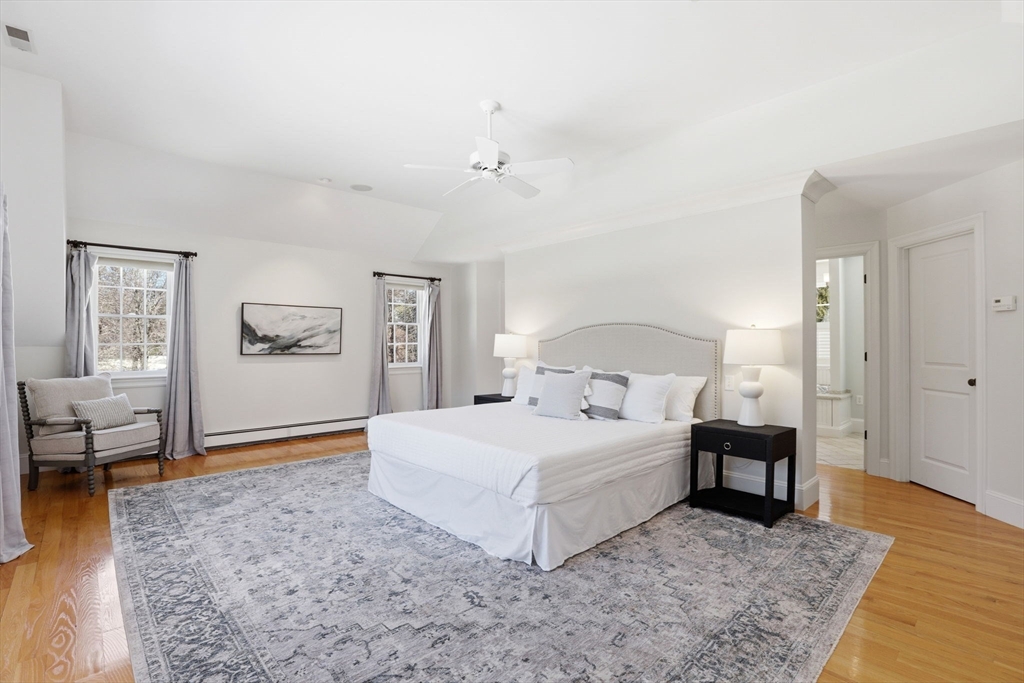 138 Judge Cushing Road Scituate, MA 02066 - Photo 25 of 40 a bedroom with a large bed and a couch