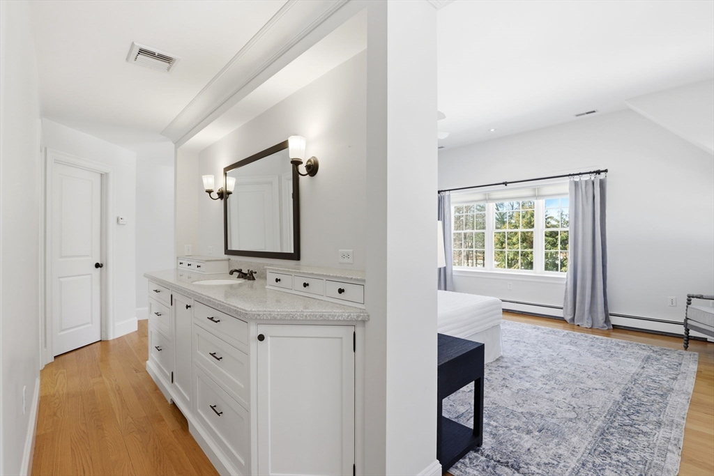 138 Judge Cushing Road Scituate, MA 02066 - Photo 26 of 40 a spacious bathroom with a double vanity sink a mirror and a bathtub