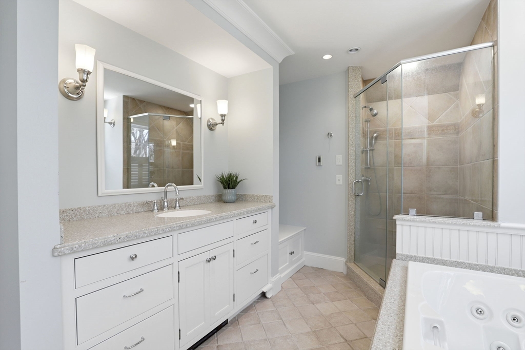 138 Judge Cushing Road Scituate, MA 02066 - Photo 27 of 40 a bathroom with a granite countertop sink a toilet a mirror and shower
