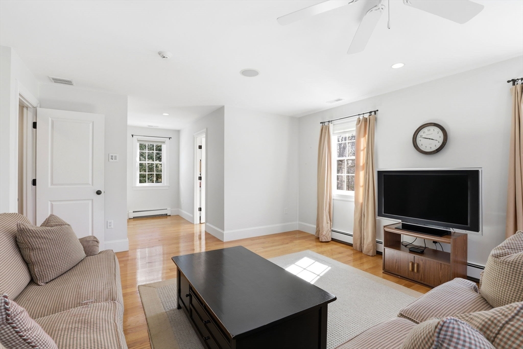 138 Judge Cushing Road Scituate, MA 02066 - Photo 28 of 40 a living room with furniture and a flat screen tv