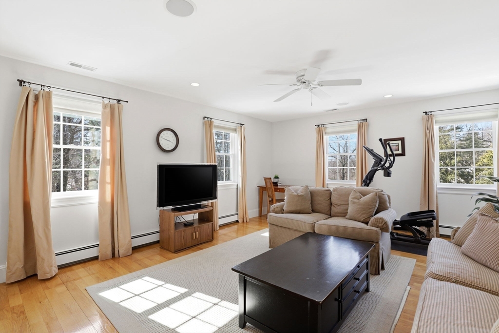 138 Judge Cushing Road Scituate, MA 02066 - Photo 29 of 40 a living room with furniture and a flat screen tv