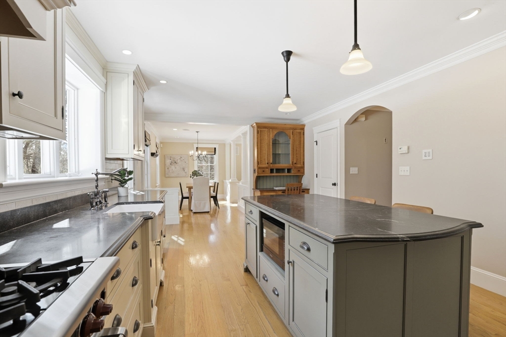138 Judge Cushing Road Scituate, MA 02066 - Photo 5 of 40 a kitchen with stainless steel appliances granite countertop a sink a stove and a wooden floors