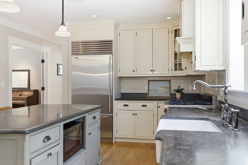 138 Judge Cushing Road Scituate, MA 02066 - Photo 6 of 40 a kitchen with granite countertop a sink a stove and cabinets
