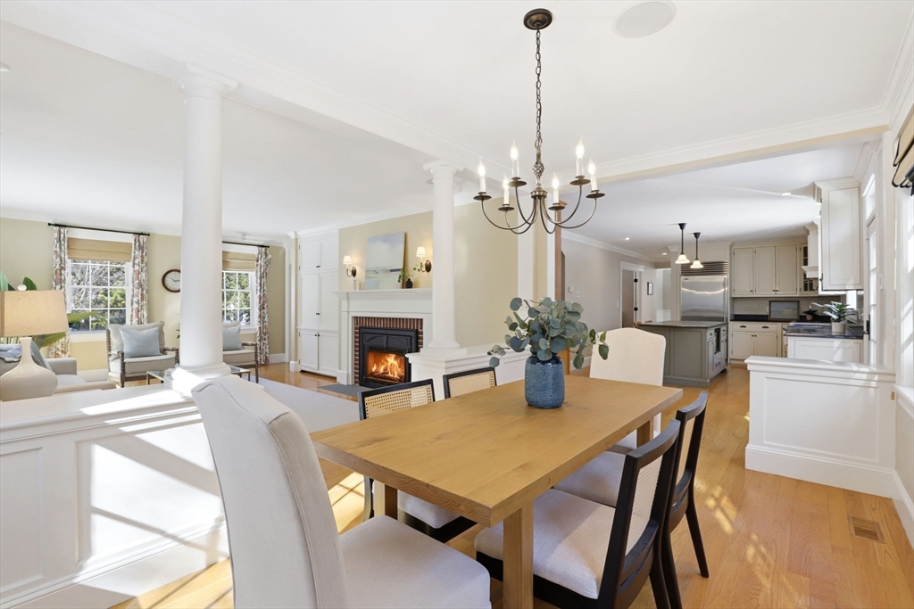138 Judge Cushing Road Scituate, MA 02066 - Photo 8 of 40 a view of a dining room and livingroom with furniture wooden floor a chandelier