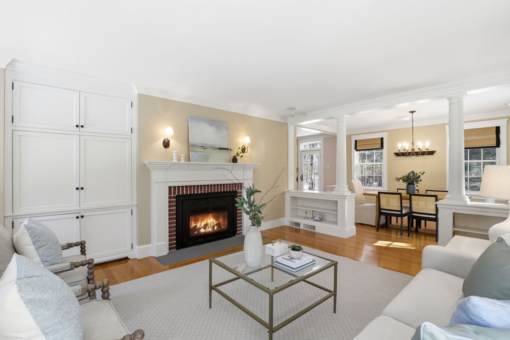 138 Judge Cushing Road Scituate, MA 02066 - Photo 10 of 40 a living room with furniture and a fireplace