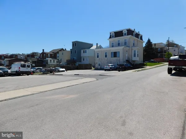 a view of a street with a building in the background