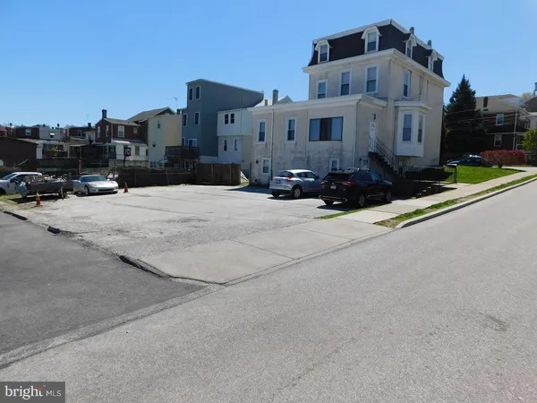 a view of a street with a building in the background