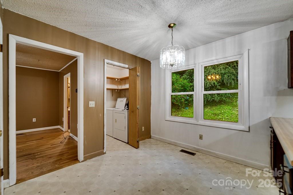 302 Mitchell Road Sylva, NC 28779 - Photo 11 of 48 a view of an empty room with a window