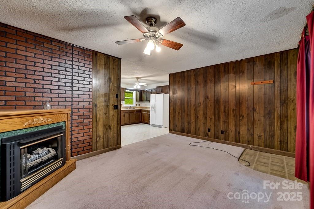 302 Mitchell Road Sylva, NC 28779 - Photo 18 of 48 a view of an empty room with a fireplace