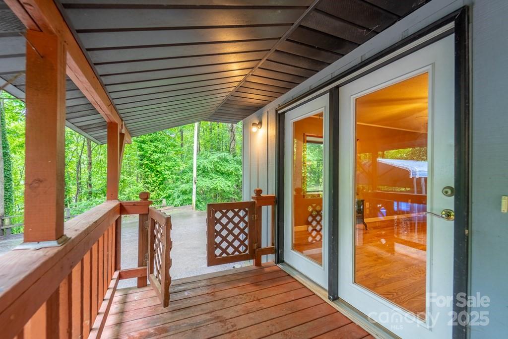 302 Mitchell Road Sylva, NC 28779 - Photo 27 of 48 a view of a deck with wooden floor and outdoor space