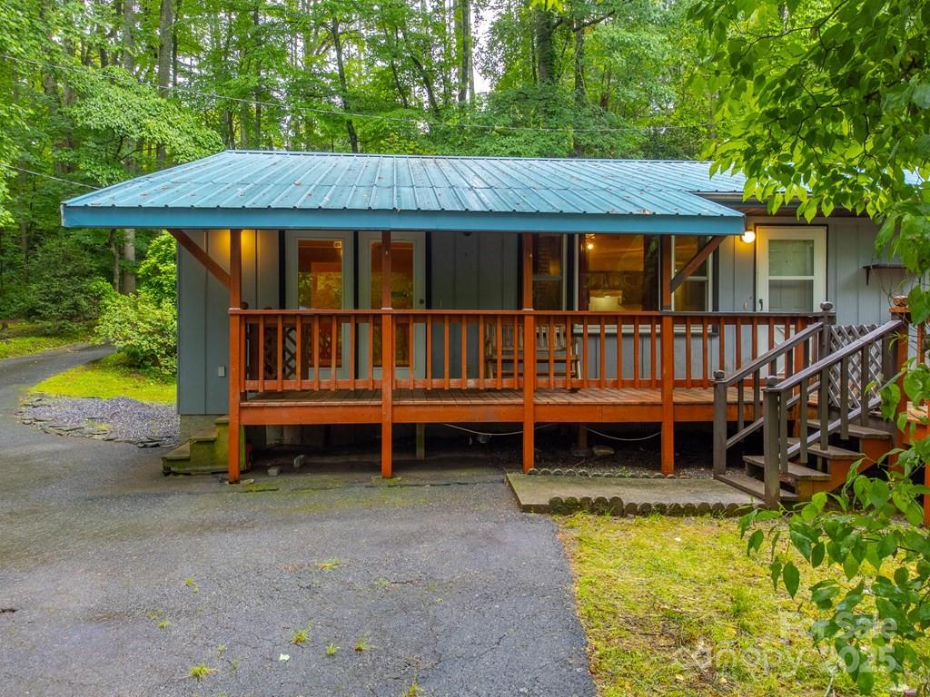 302 Mitchell Road Sylva, NC 28779 - Photo 29 of 48 a view of a house with a yard and sitting area