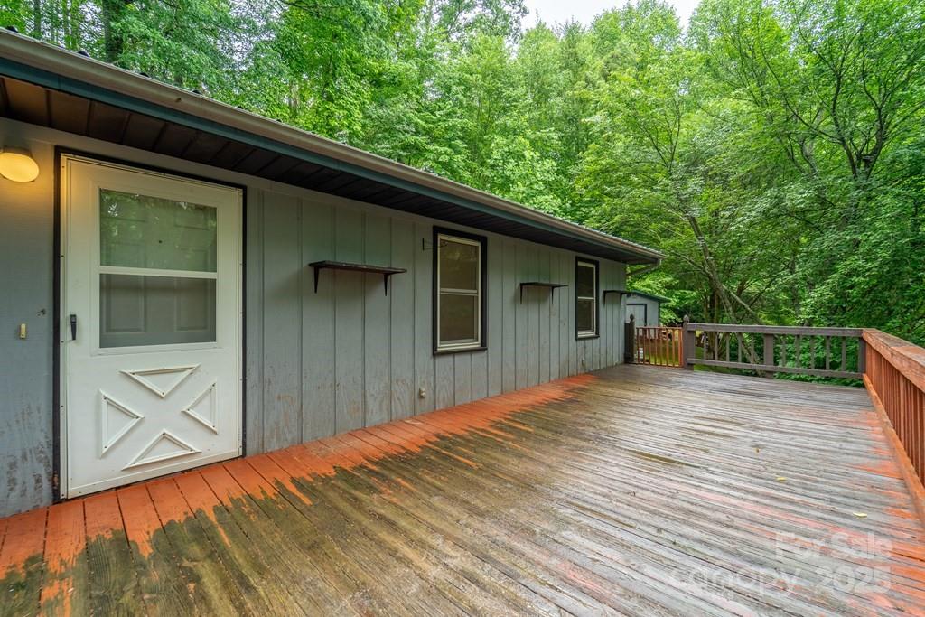 302 Mitchell Road Sylva, NC 28779 - Photo 32 of 48 a backyard of a house with wooden floor