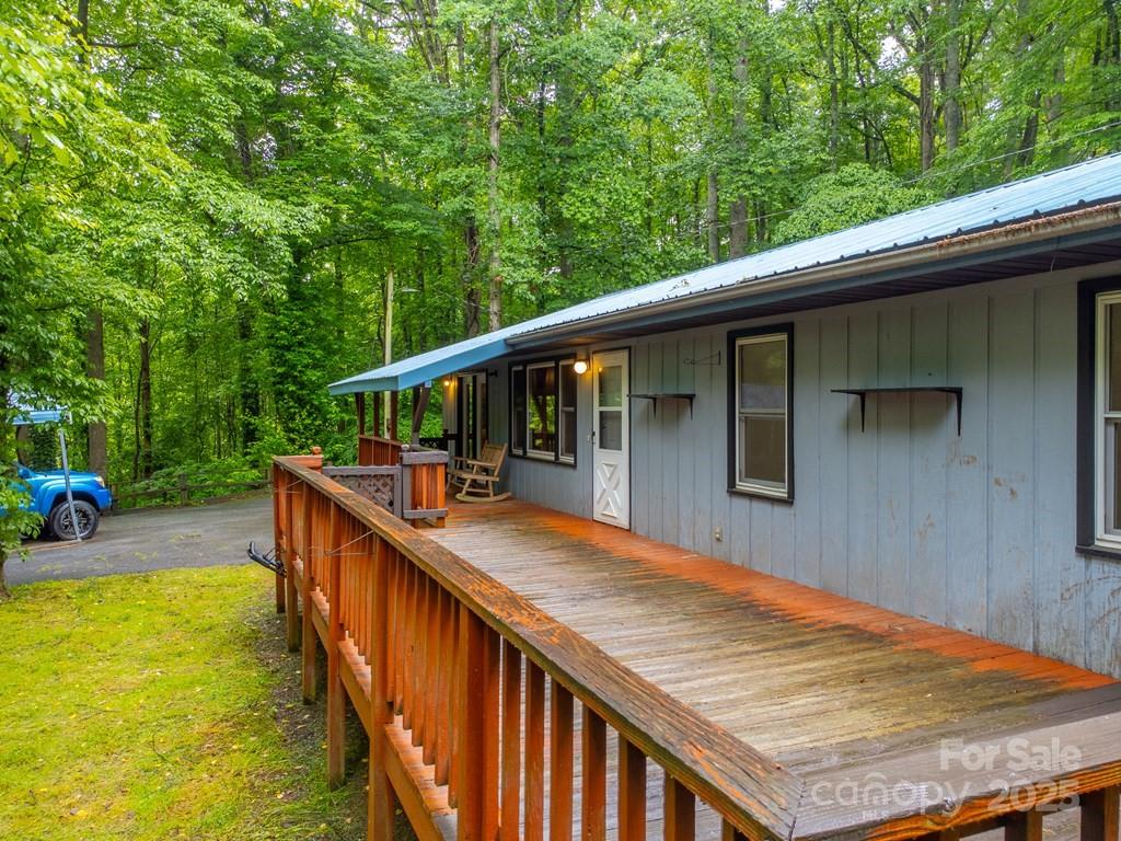 302 Mitchell Road Sylva, NC 28779 - Photo 41 of 48 a balcony with wooden floor and outdoor seating