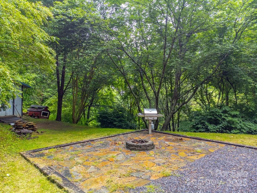 302 Mitchell Road Sylva, NC 28779 - Photo 44 of 48 a view of a backyard with swimming pool
