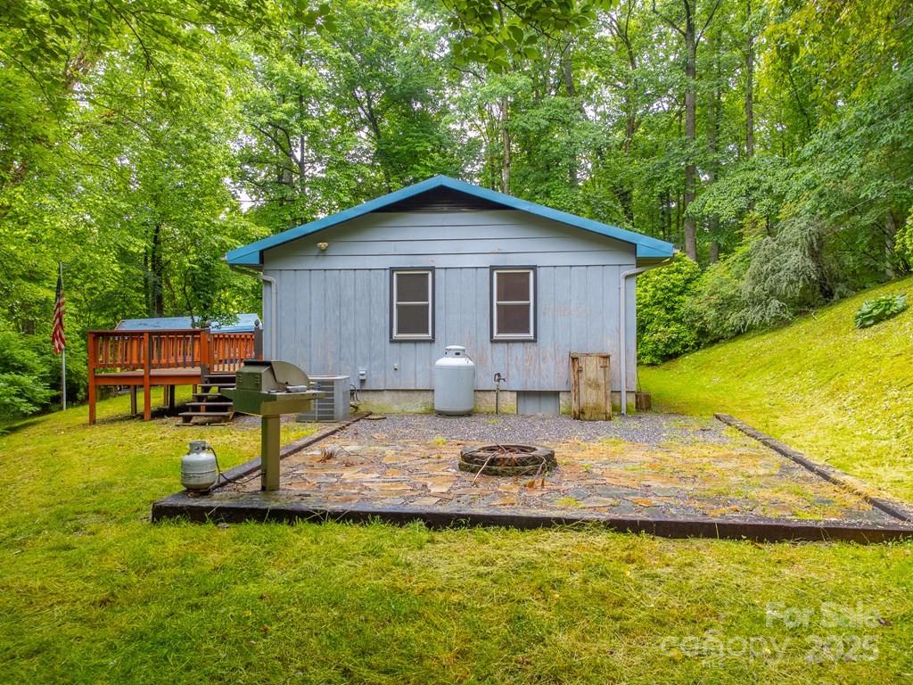 302 Mitchell Road Sylva, NC 28779 - Photo 46 of 48 a view of a house with a swimming pool and sitting area