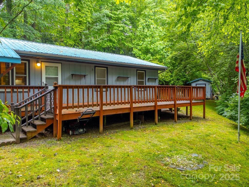 302 Mitchell Road Sylva, NC 28779 - Photo 5 of 48 a view of a deck with a table and chairs