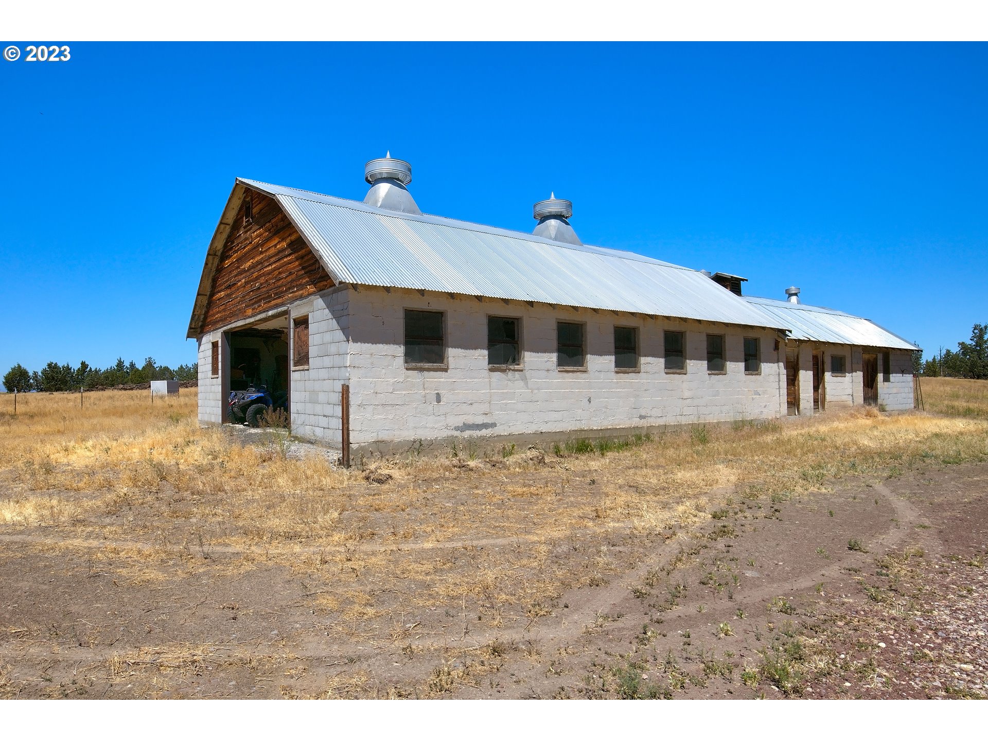 11677 Southwest Houston Lake Road Powell Butte, OR 97753 - Photo 27 of 35 a view of a house with backyard