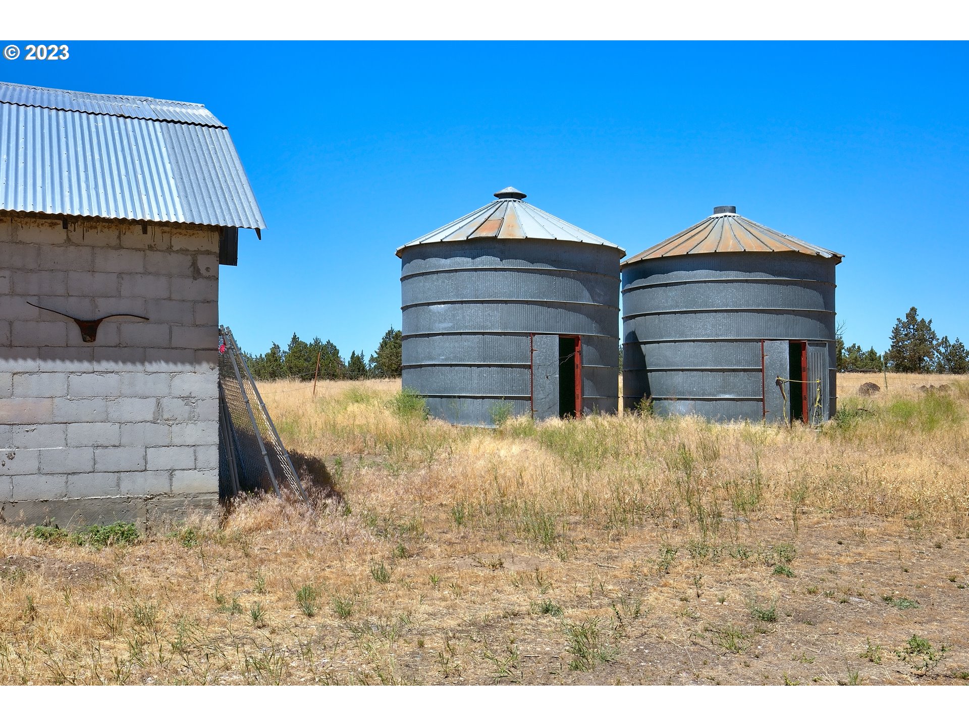 11677 Southwest Houston Lake Road Powell Butte, OR 97753 - Photo 28 of 35 a view of wooden door and entryway